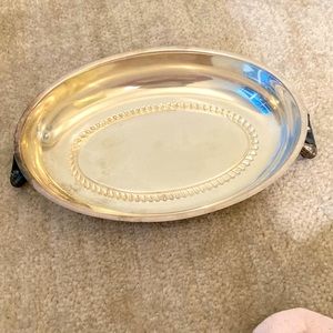 10 inch oval silver plate dish. Plating loss on handles. See photos.